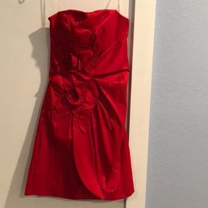 Red strapless cocktail dress.